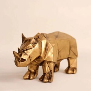 Золотистая фигурка носорога в стиле кубизм